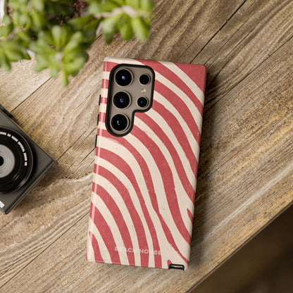 Kure Beach Tough Case for Galaxy with red and white striped pattern on a wooden surface