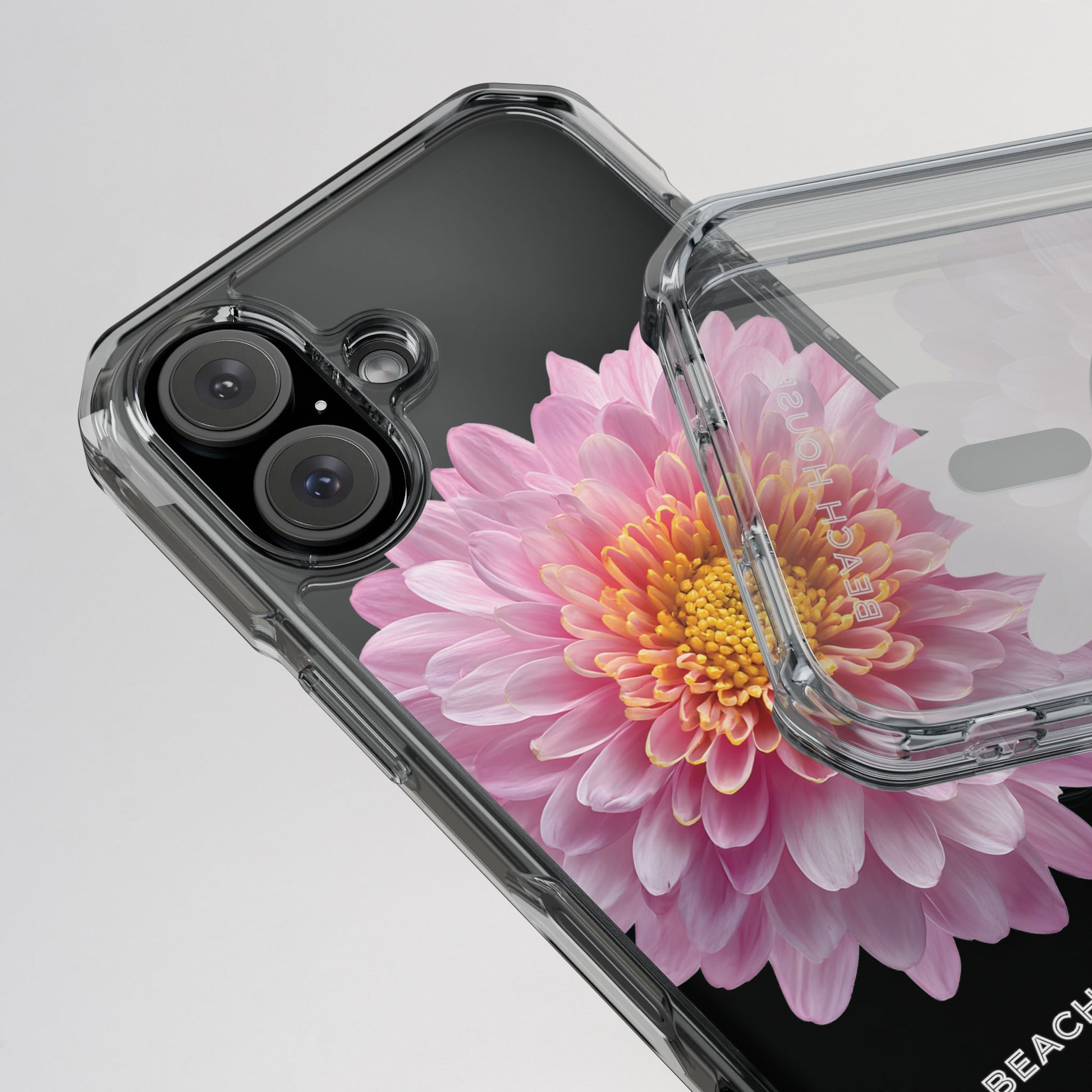 Phone case with a pink flower design on a clear background