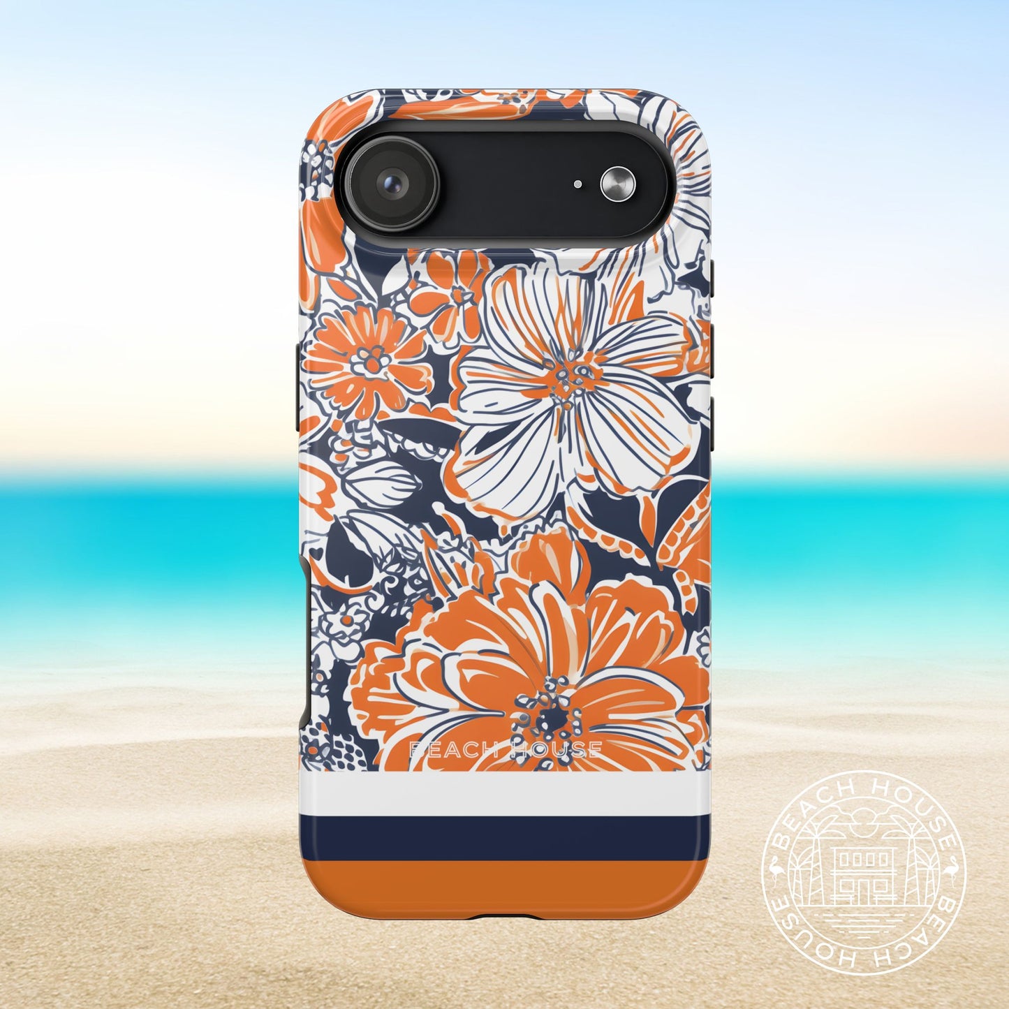 Charlottesville Tough Case for iPhone 17 Air with orange and navy floral pattern on a beach background