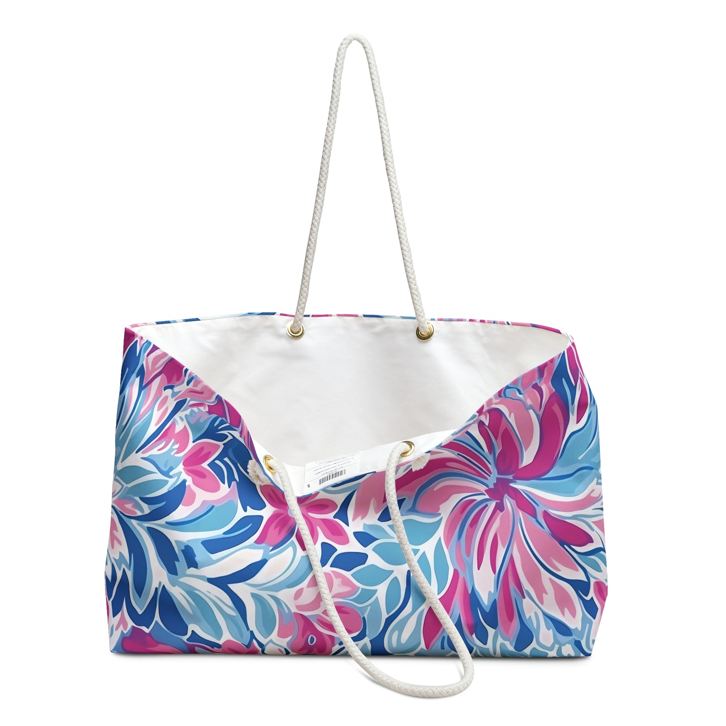 Colorful floral-patterned Destin weekender tote bag with a white interior on a white background