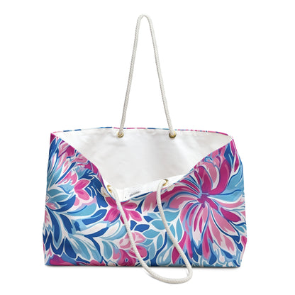 Colorful floral-patterned Destin weekender tote bag with a white interior on a white background