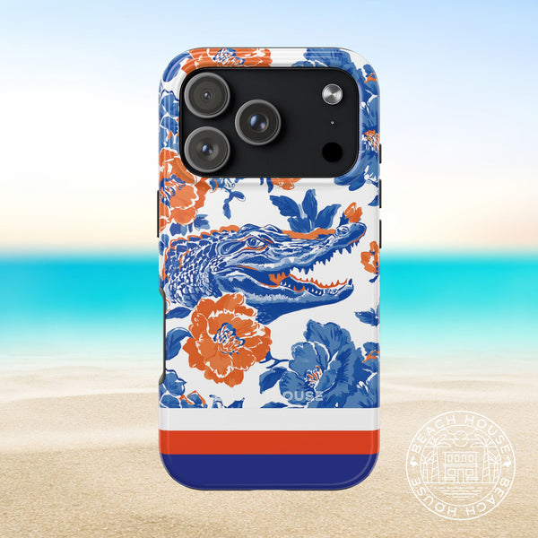 Gainesville Tough Case for iPhone 17 Pro with floral and alligator design on a beach background