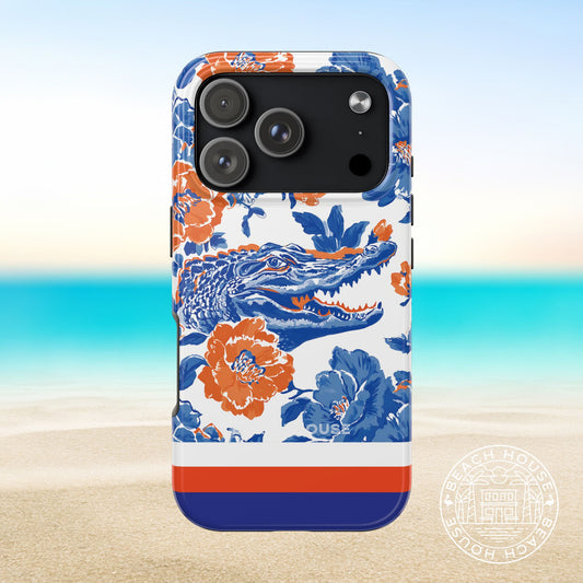 Gainesville Tough Case for iPhone 17 Pro with floral and alligator design on a beach background
