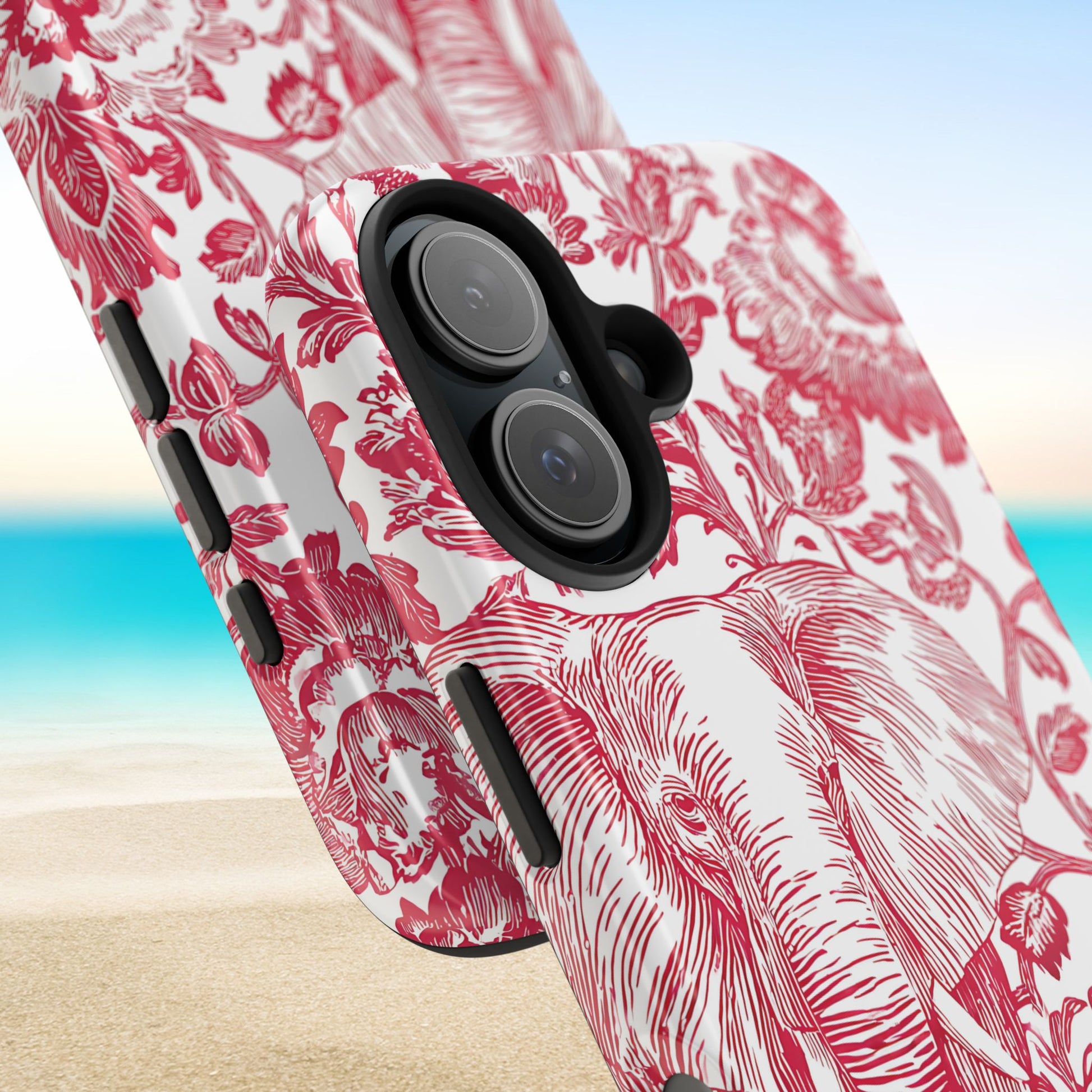 Close up views of the Tuscaloosa Tough Case for iPhone with red floral pattern on a beach background