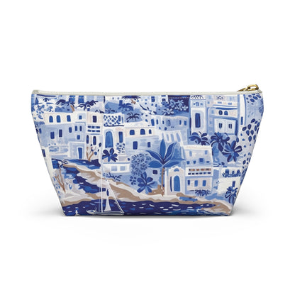 Blue and white patterned pouch with a scenic design on a white background