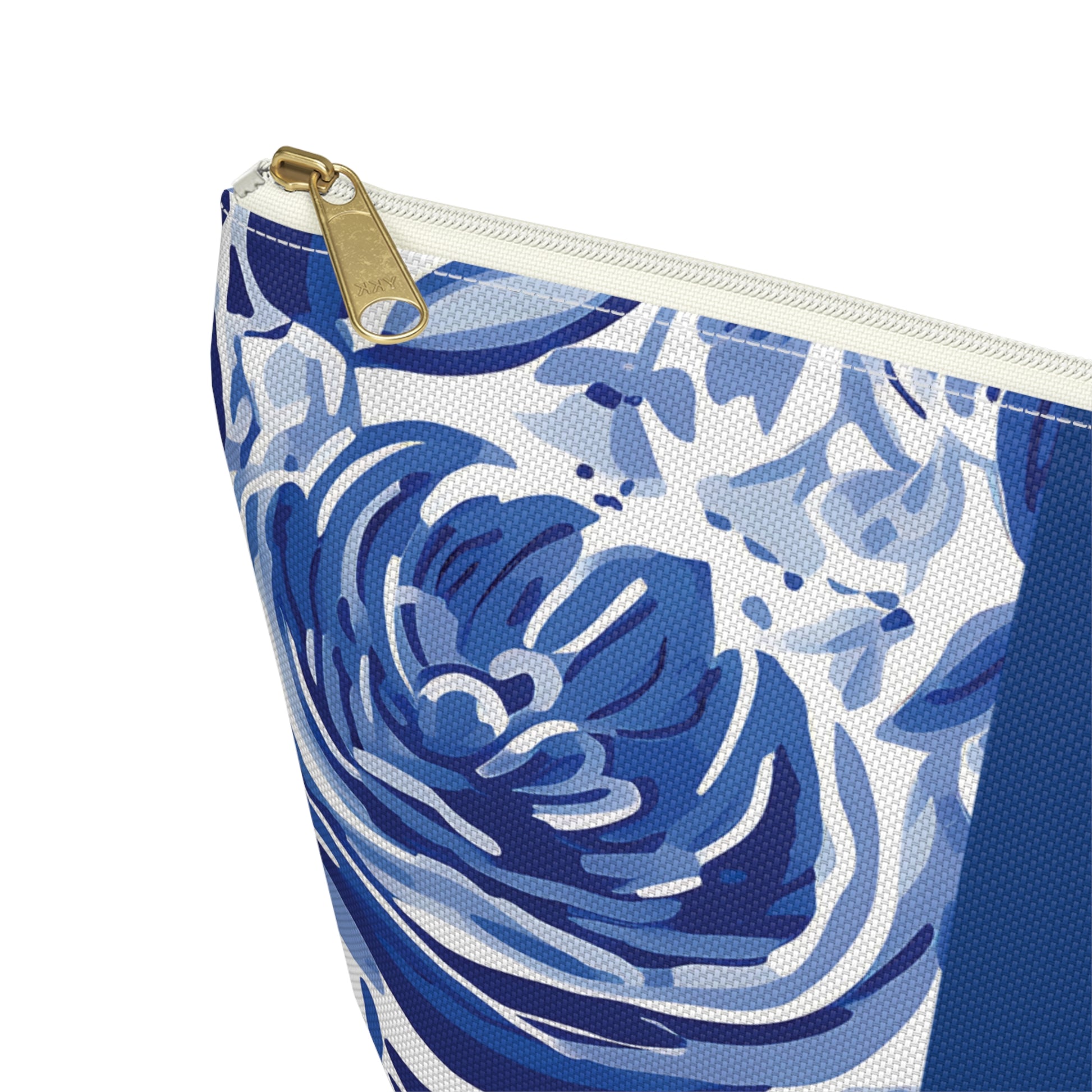 Blue floral patterned pouch with a gold zipper on a white background