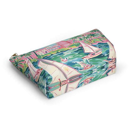 Bottom view of accessory pouch with sailboat and palm tree pattern on a white background