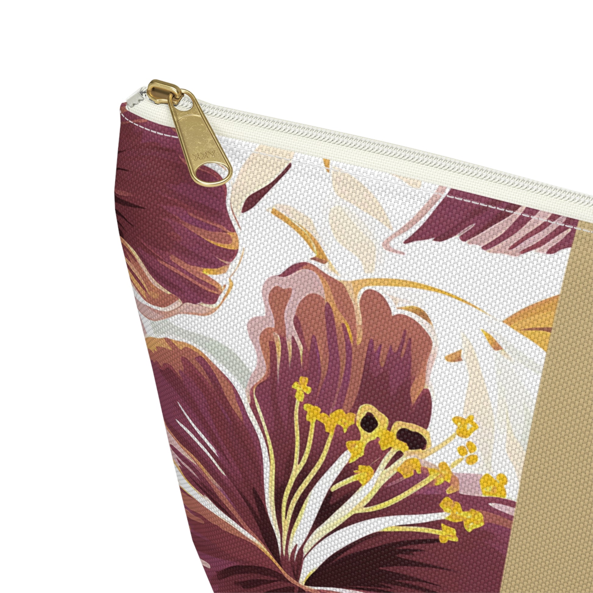Floral-patterned pouch with a gold zipper on a white background