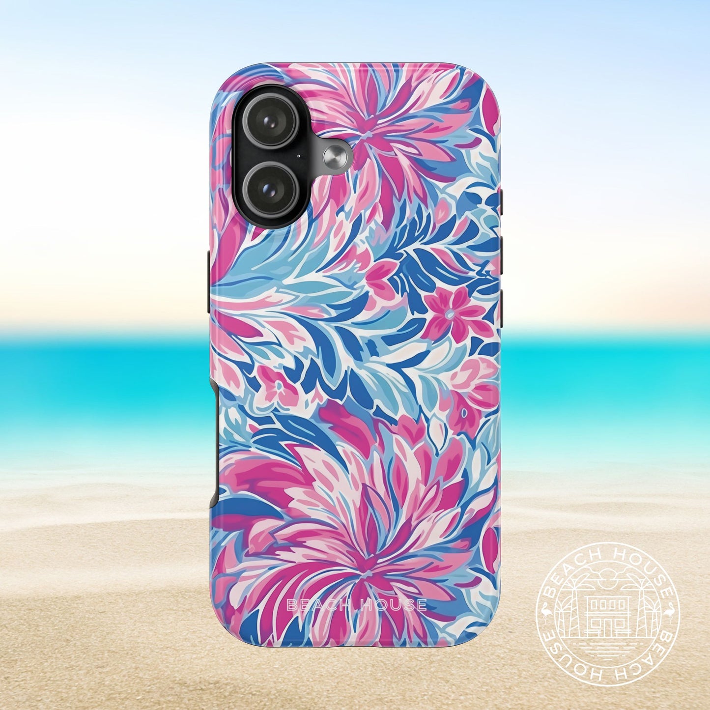 Destin Tough Case for iPhone 17 with pink and blue floral pattern on a beach background