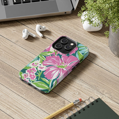 Floral Seaside Tough Case for iPhone on a wooden desk with laptop, earbuds, and notebook.