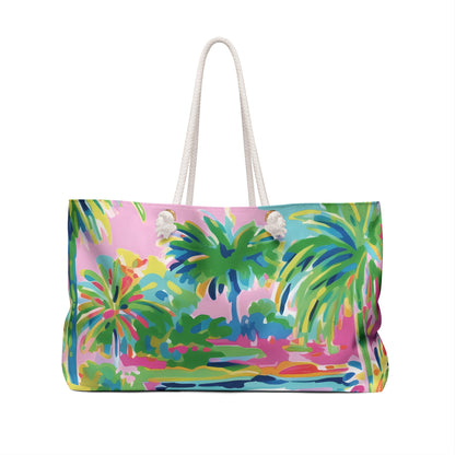 Back view of a colorful Delray beach bag with palm tree design on a white background