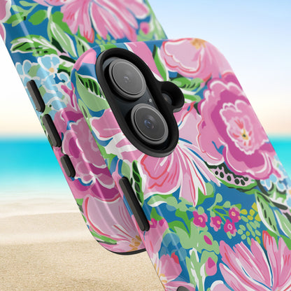 Close up view of top and bottom of the Floral Madeira Tough Case for iPhone with a beach background