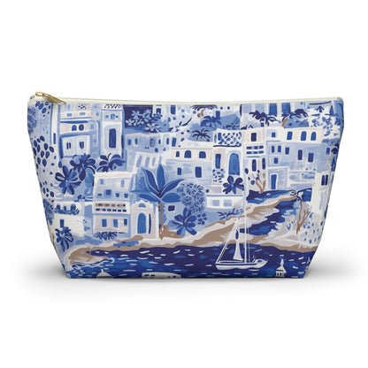 Blue and white patterned pouch with a scenic design on a white background