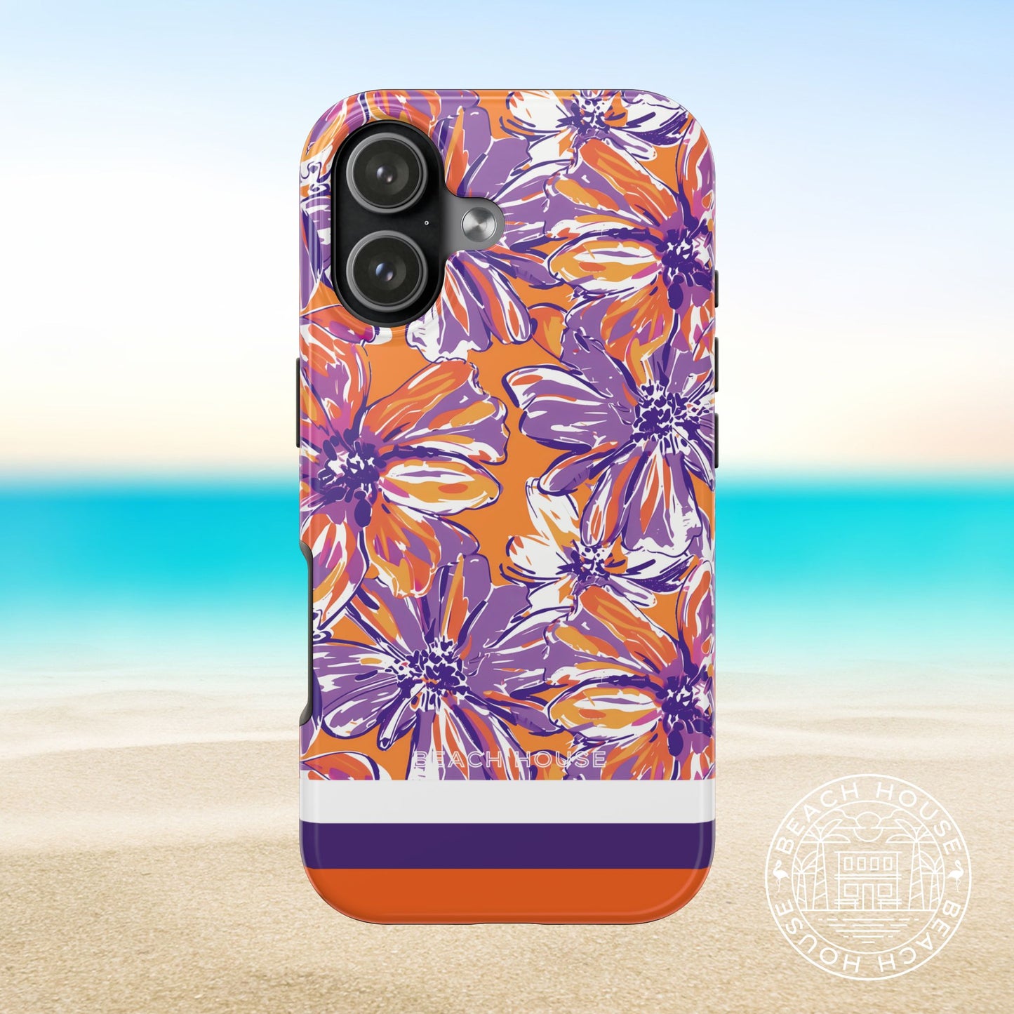 Clemson Tough Case for iPhone 17 with purple and orange floral and striped design on a beach background