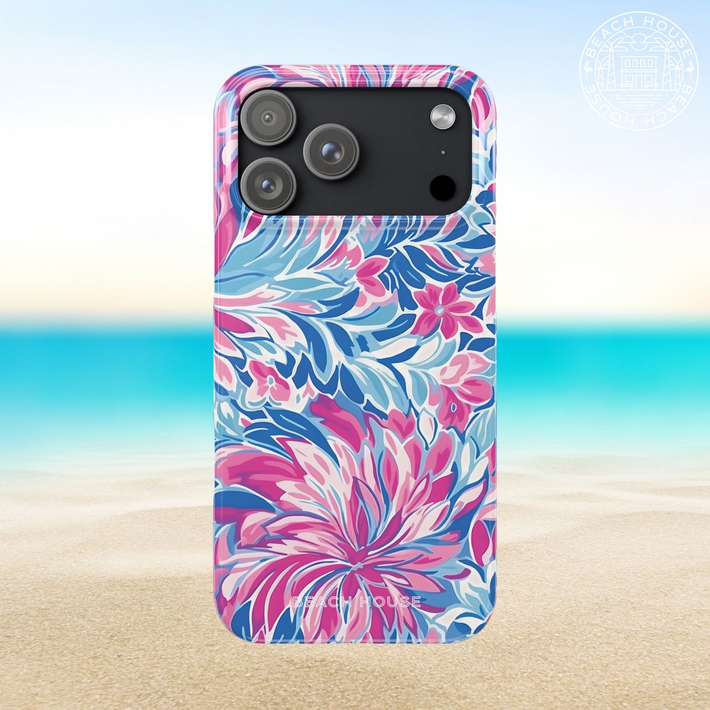 Destin Slim Case for iPhone 17 Pro Max with pink and blue floral pattern on a beach background
