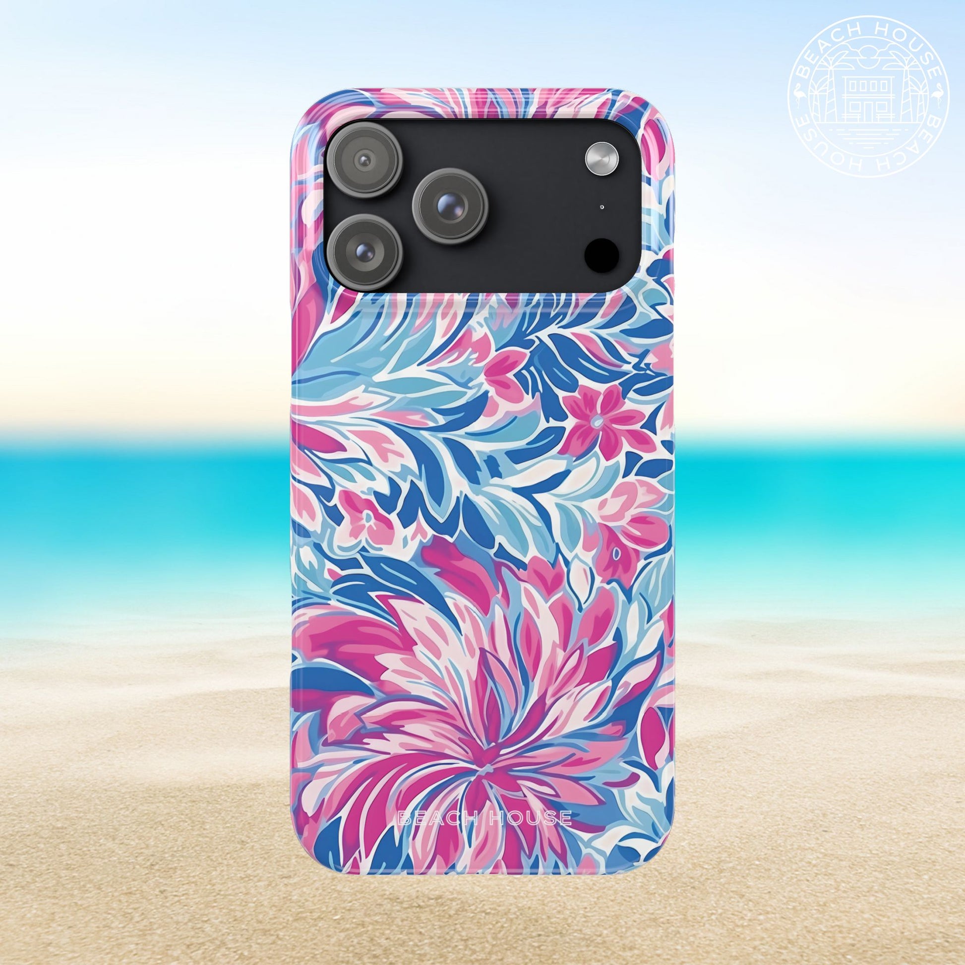 Destin Slim Case for iPhone 17 Pro Max with pink and blue floral pattern on a beach background