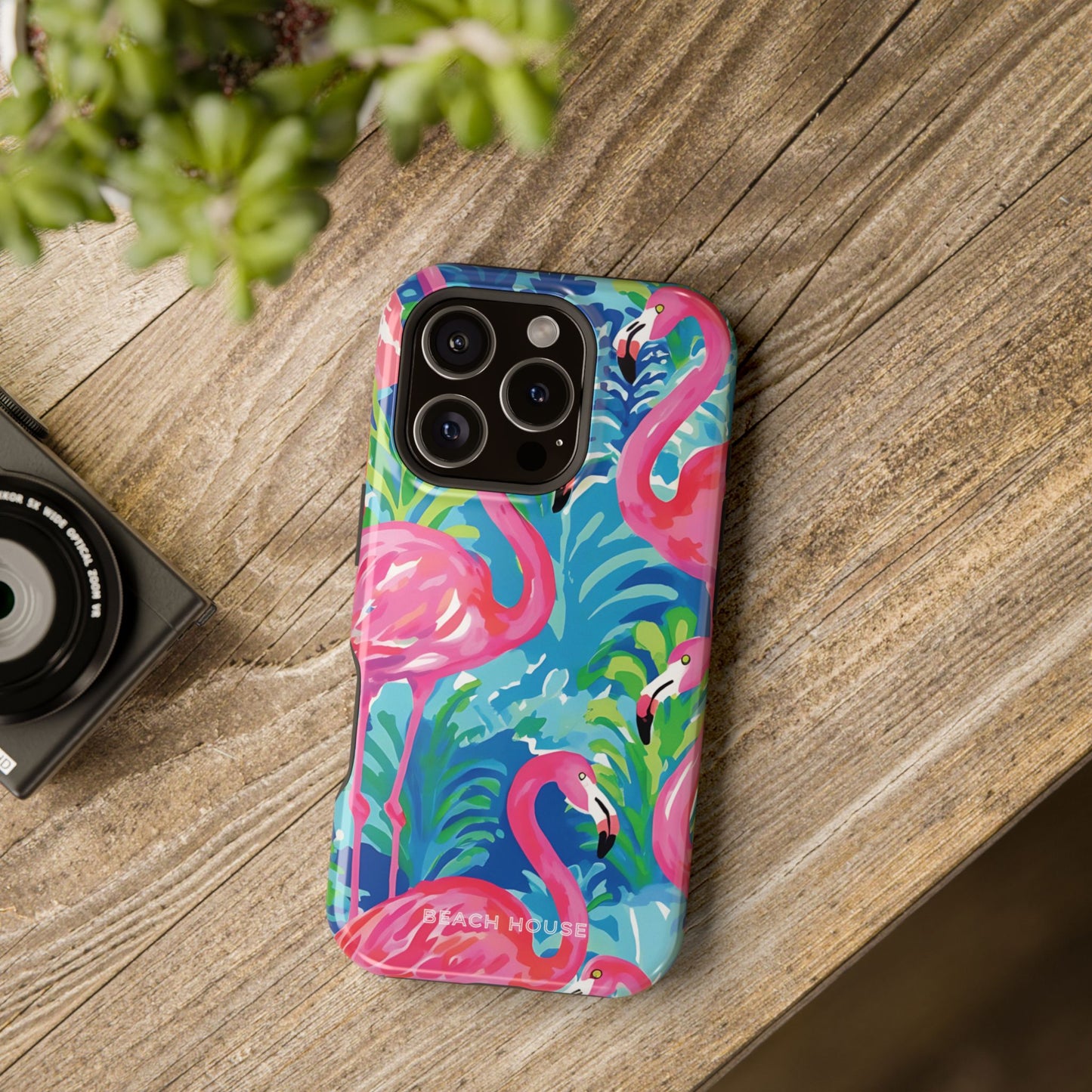 Key Largo MagSafe Tough Case for iPhone with flamingo design on a wooden surface