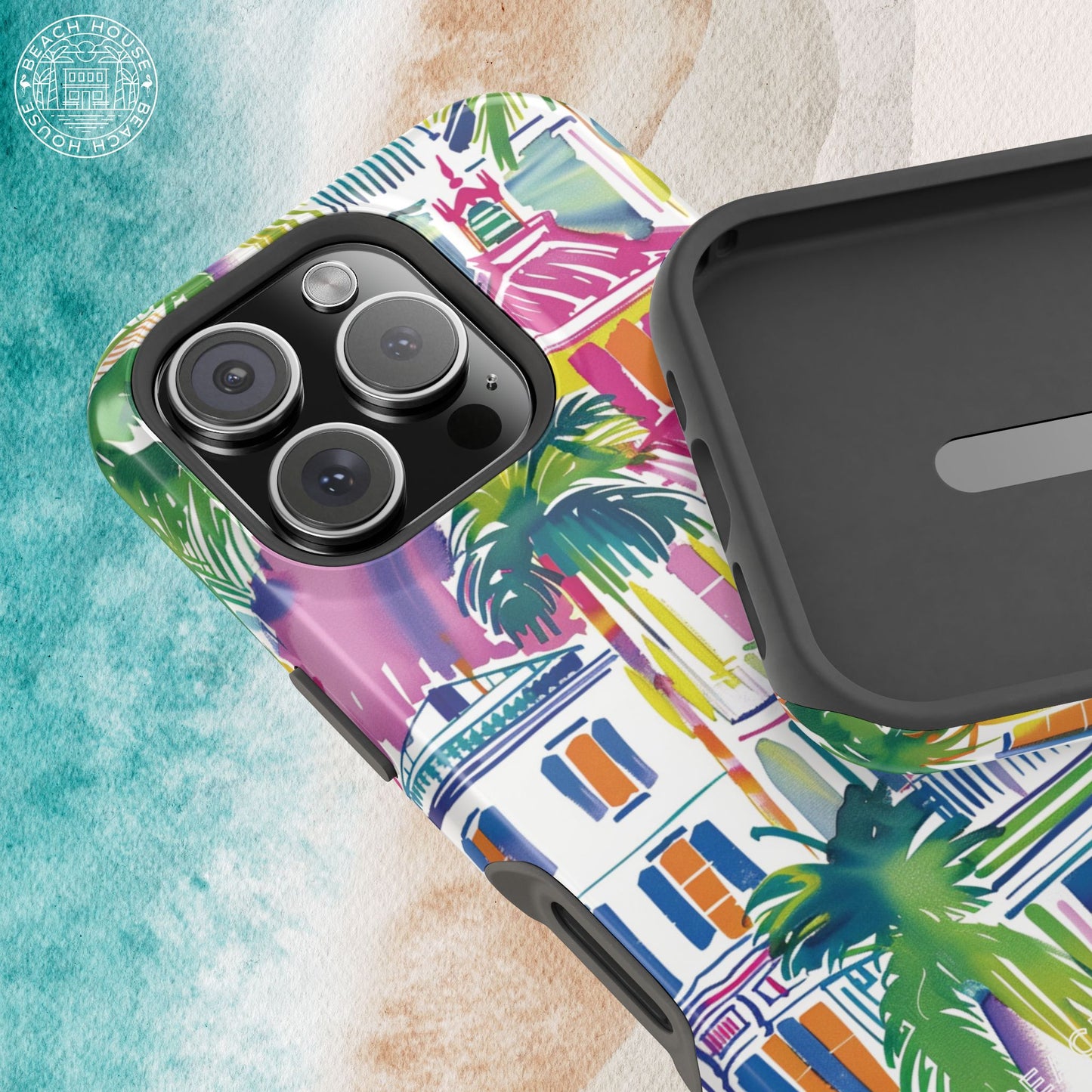 Interior and exterior view of the George Town MagSafe Tough Case for iPhone with palm tree design, on a textured surface