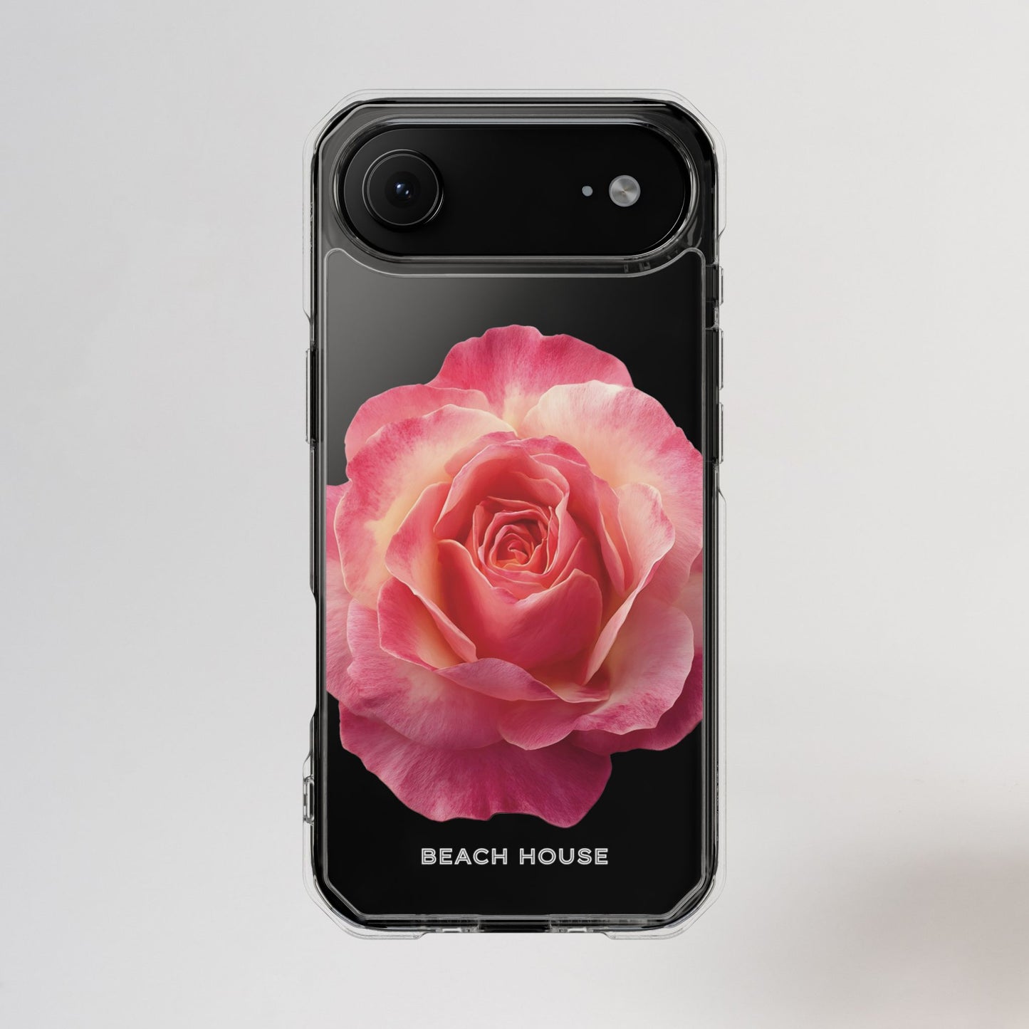 Phone case with a pink rose design on a light gray background