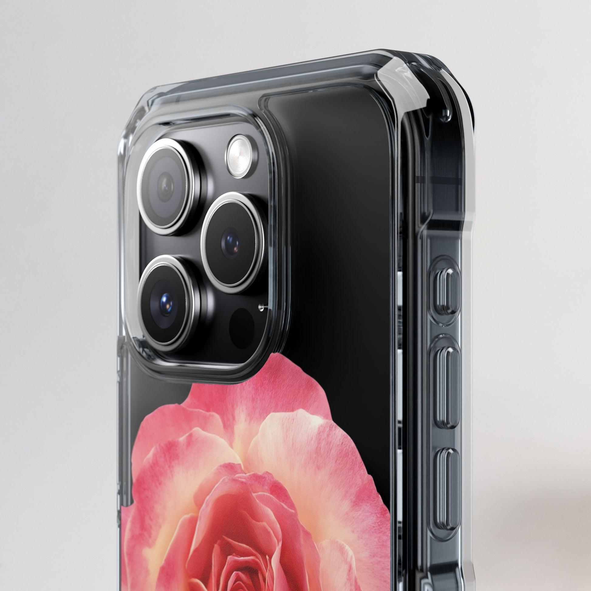 Phone case with a pink rose design on a gray background