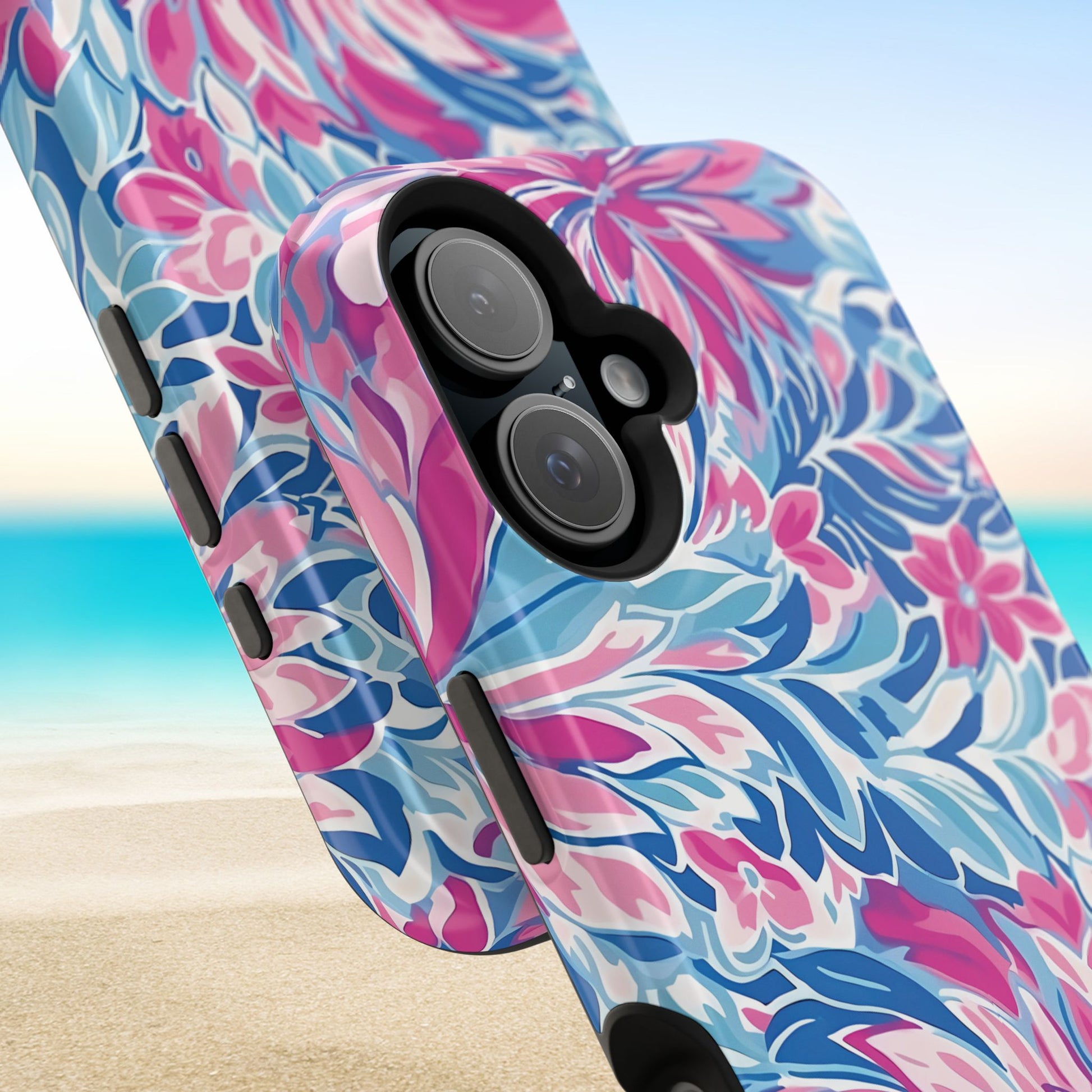 Views of the Destin Phone case details and buttons, with pink and blue pattern on a beach background