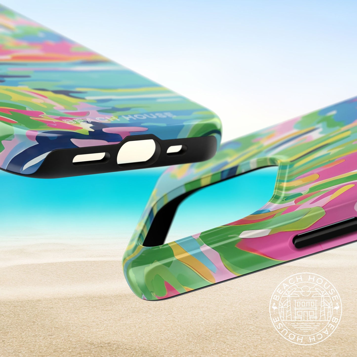 Top and bottom views of the Delray Tough case for iPhone with tropical design on a beach background