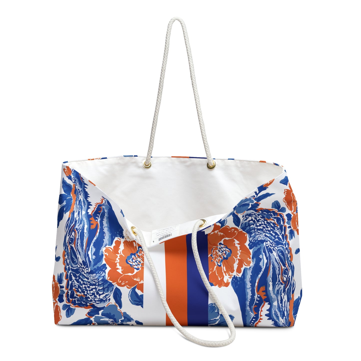 Slightly opened view of Gainesville Weekender Tote Bag with blue and orange floral pattern with a cream interior liner, on a white background