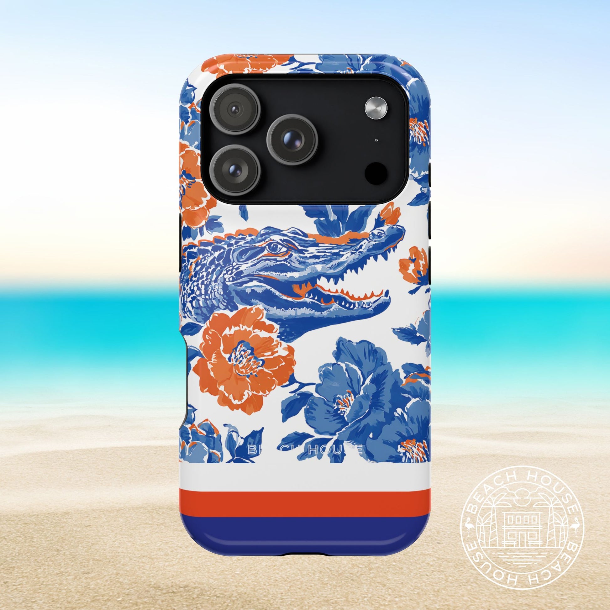 Gainesville MagSafe Tough Case for iPhone 17 Pro with floral and alligator design on a beach background