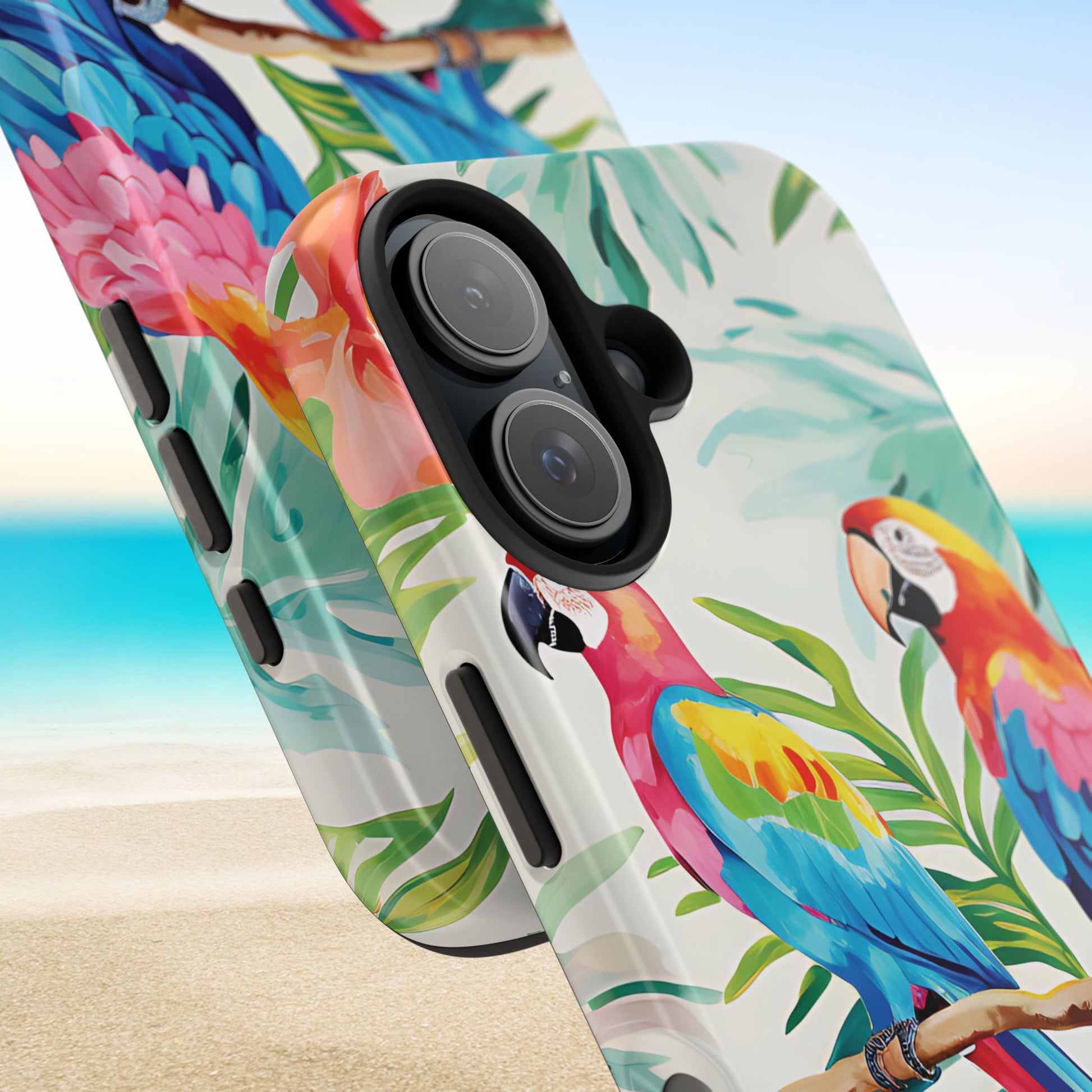 Close up views of a tropical Copacabana Tough Case for iPhone with parrot and leaf design on a beach background