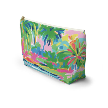 Colorful tropical print pouch on a white background