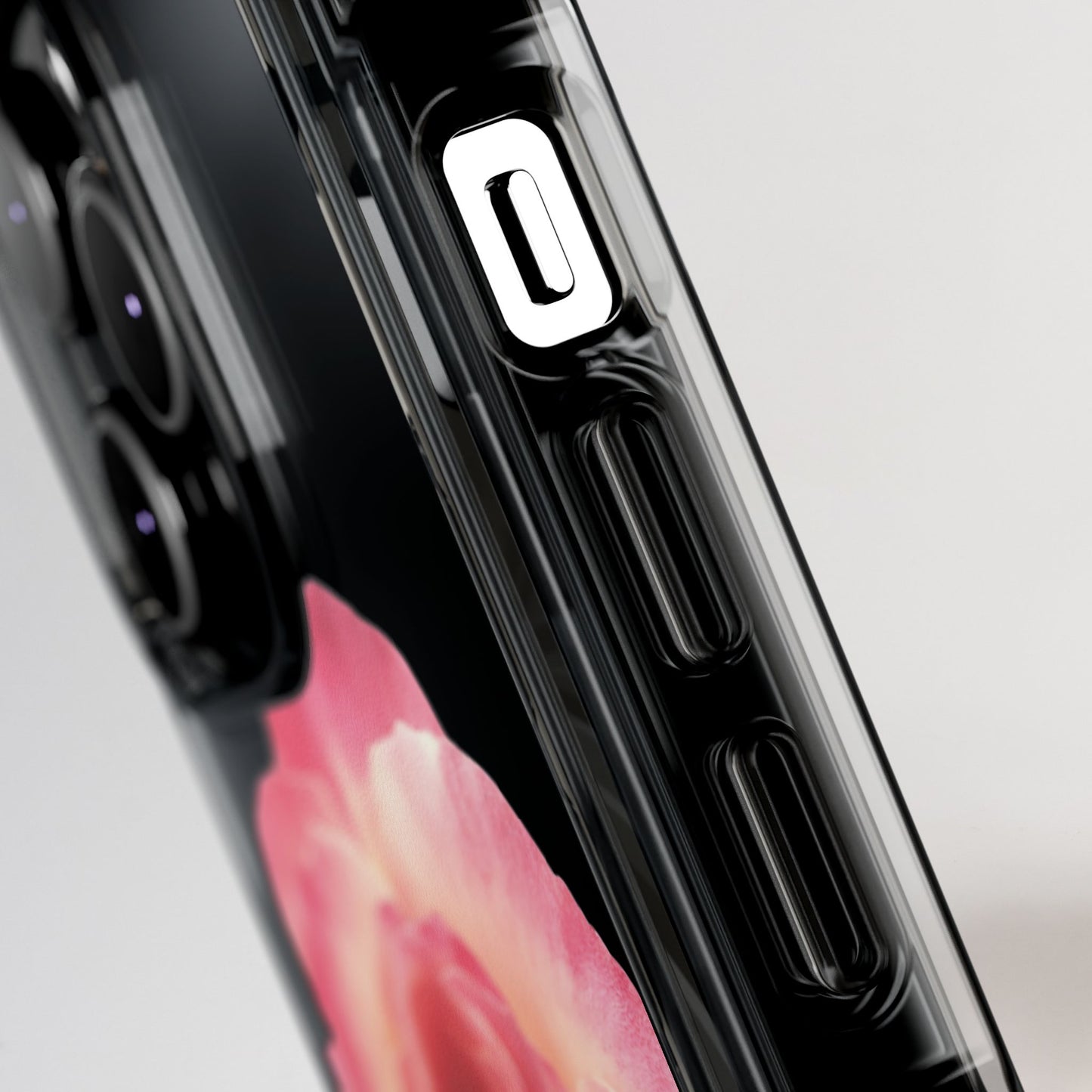 Close-up of a phone case with a floral design on a gray background