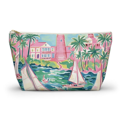 Pouch with a colorful design of palm trees, houses, and sailboats on a white background