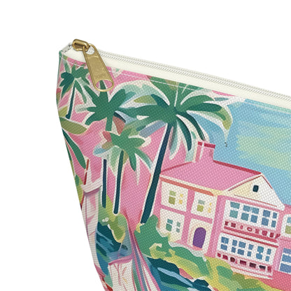 Pouch with tropical design featuring palm trees and a house on a white background