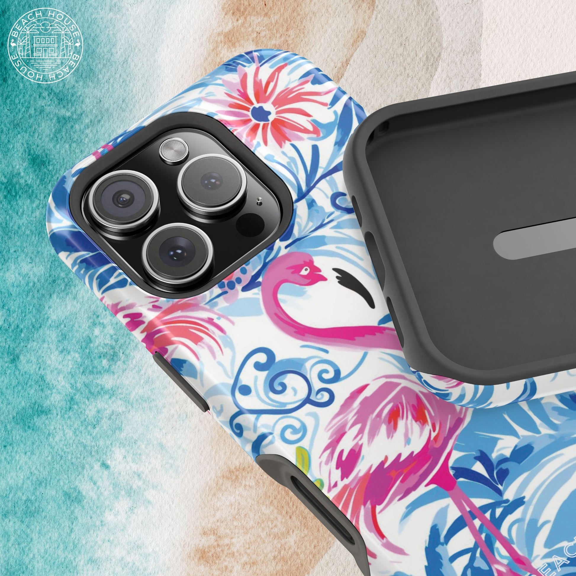 Interior and exterior view of the Flamingo Beach MagSafe Tough Case for iPhone, on a textured surface