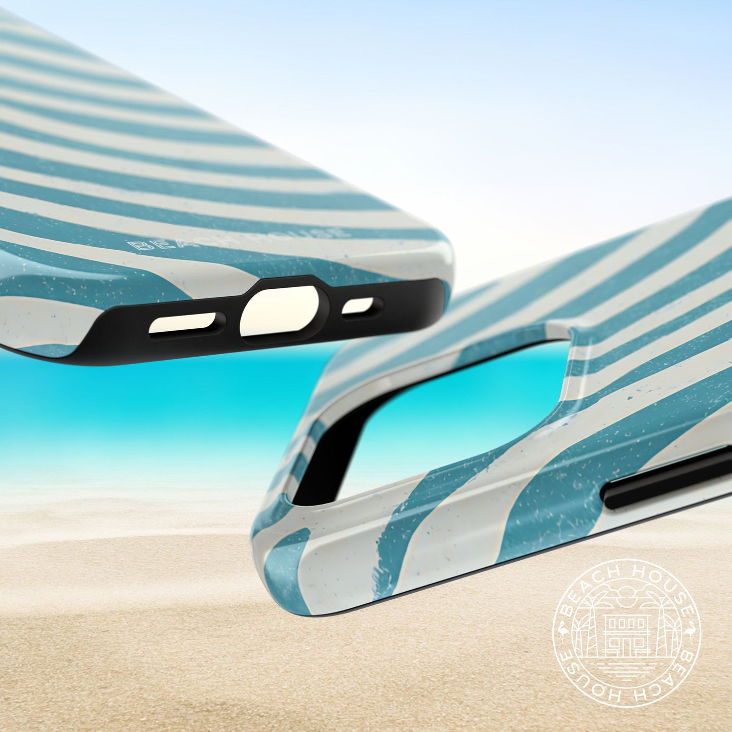 Top and bottom view of the Holmes Beach Tough Case for iPhone on a beach with sand and water in the background.