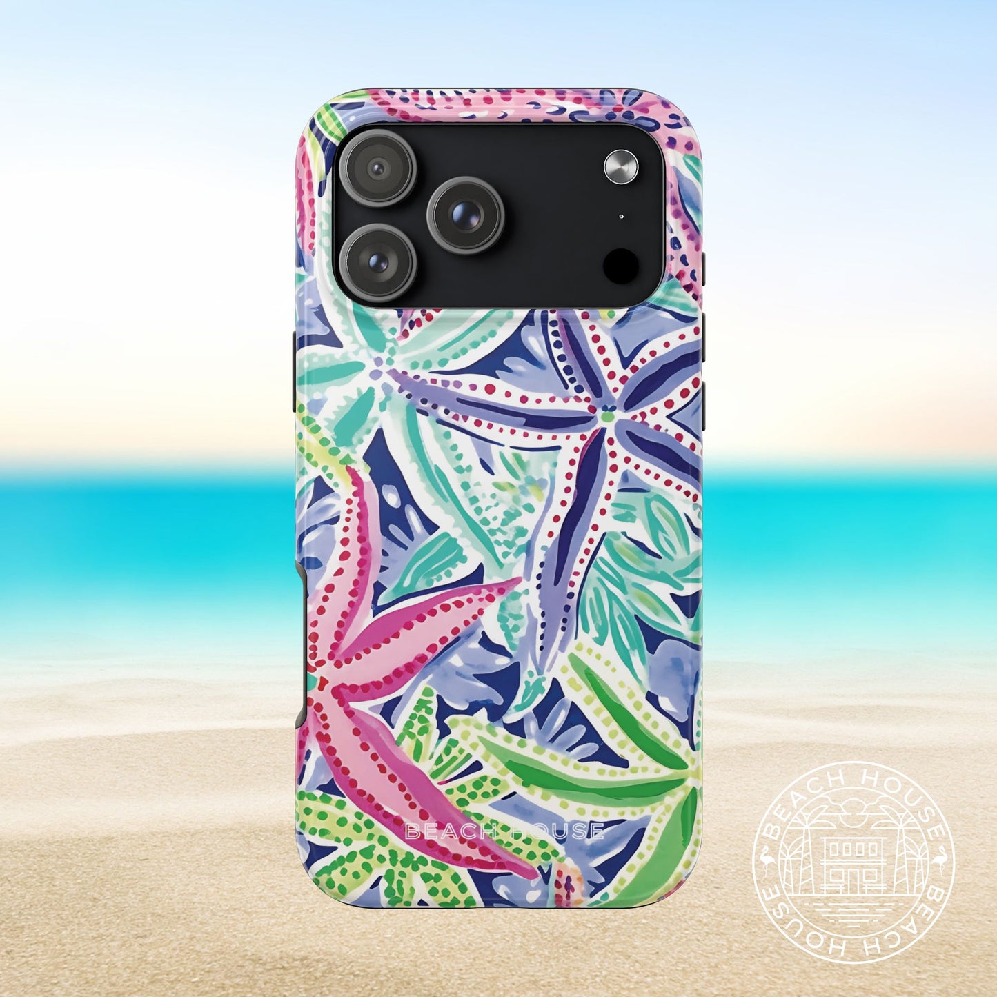 Siesta Key Tough Case for iPhone 17 Pro Max with colorful starfish pattern on a beach background