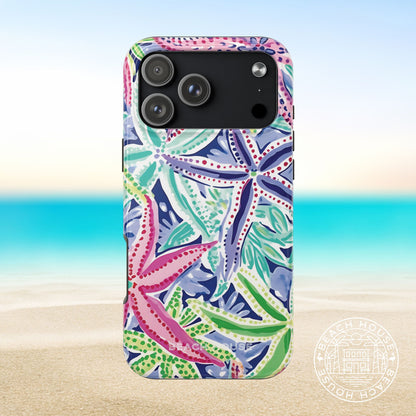 Siesta Key Tough Case for iPhone 17 Pro Max with colorful starfish pattern on a beach background