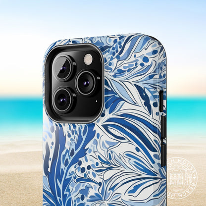 Close up view of a preppy coastal Nags Head case for iPhone with a beach background