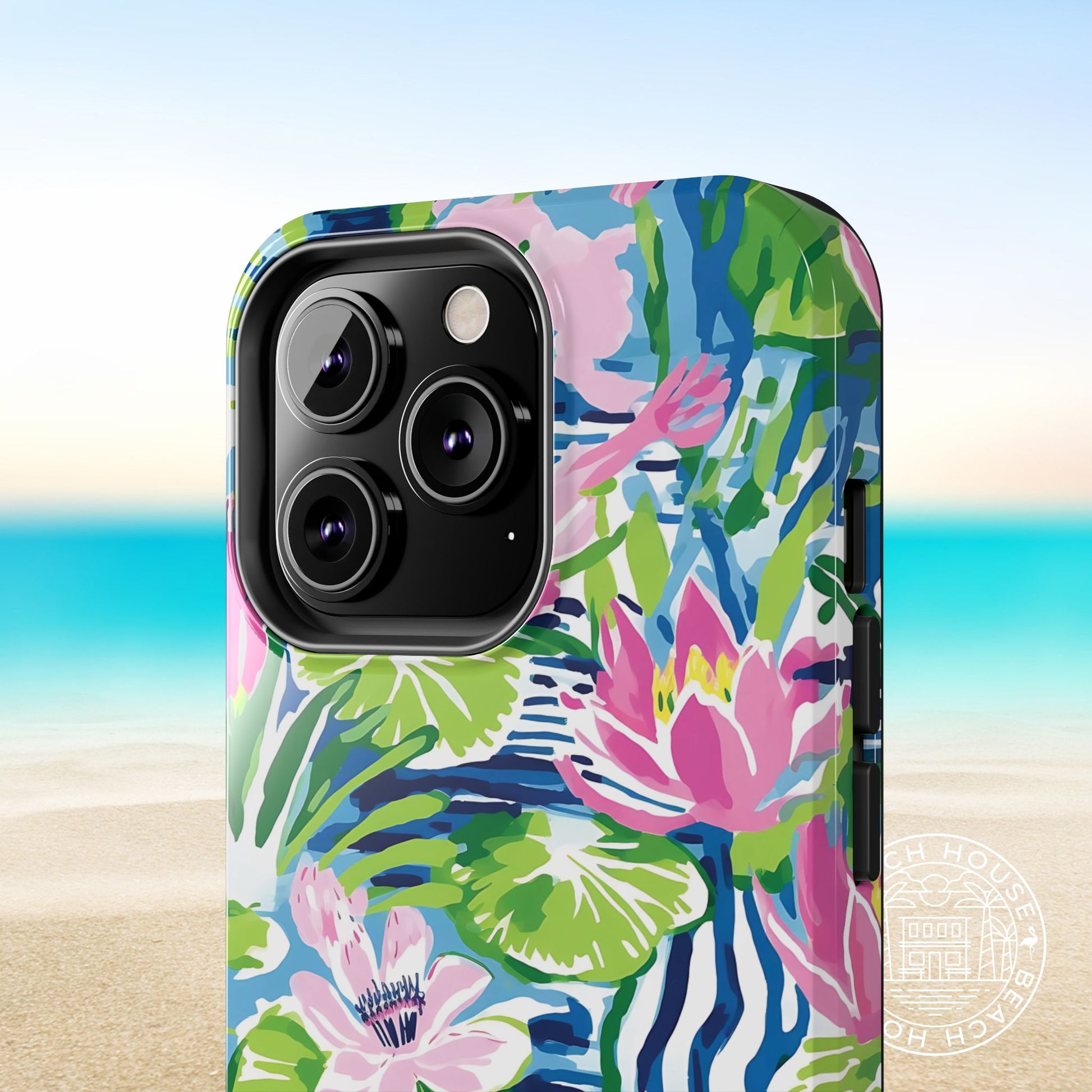 Close up view of the Everglades Tough Case for iPhone with colorful floral design on a beach background