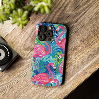 Colorful Key Largo Slim Case for iPhone with flamingo design on a wooden surface next to a camera.