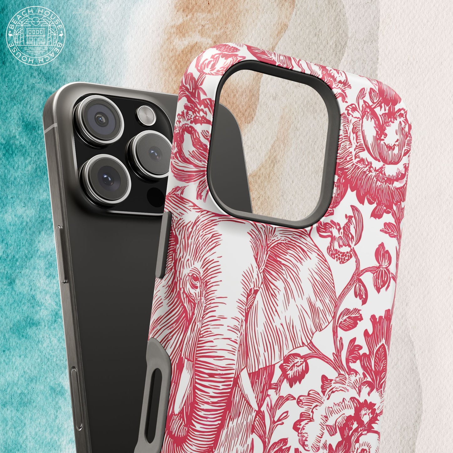 Tuscaloosa MagSafe Tough Case for iPhone with red floral and elephant design on a marble background