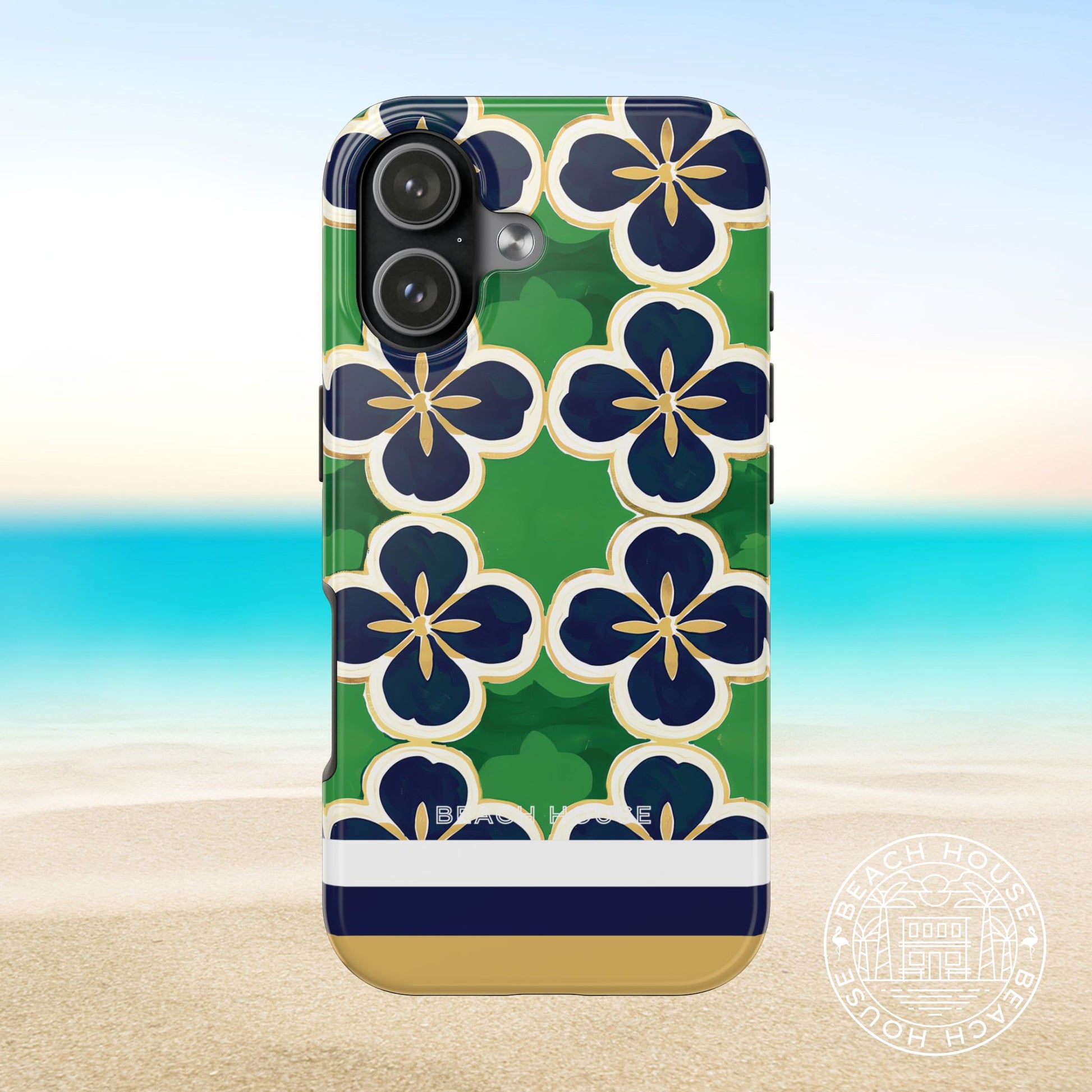 South Bend Tough Case for iPhone 17 with floral design on a beach background
