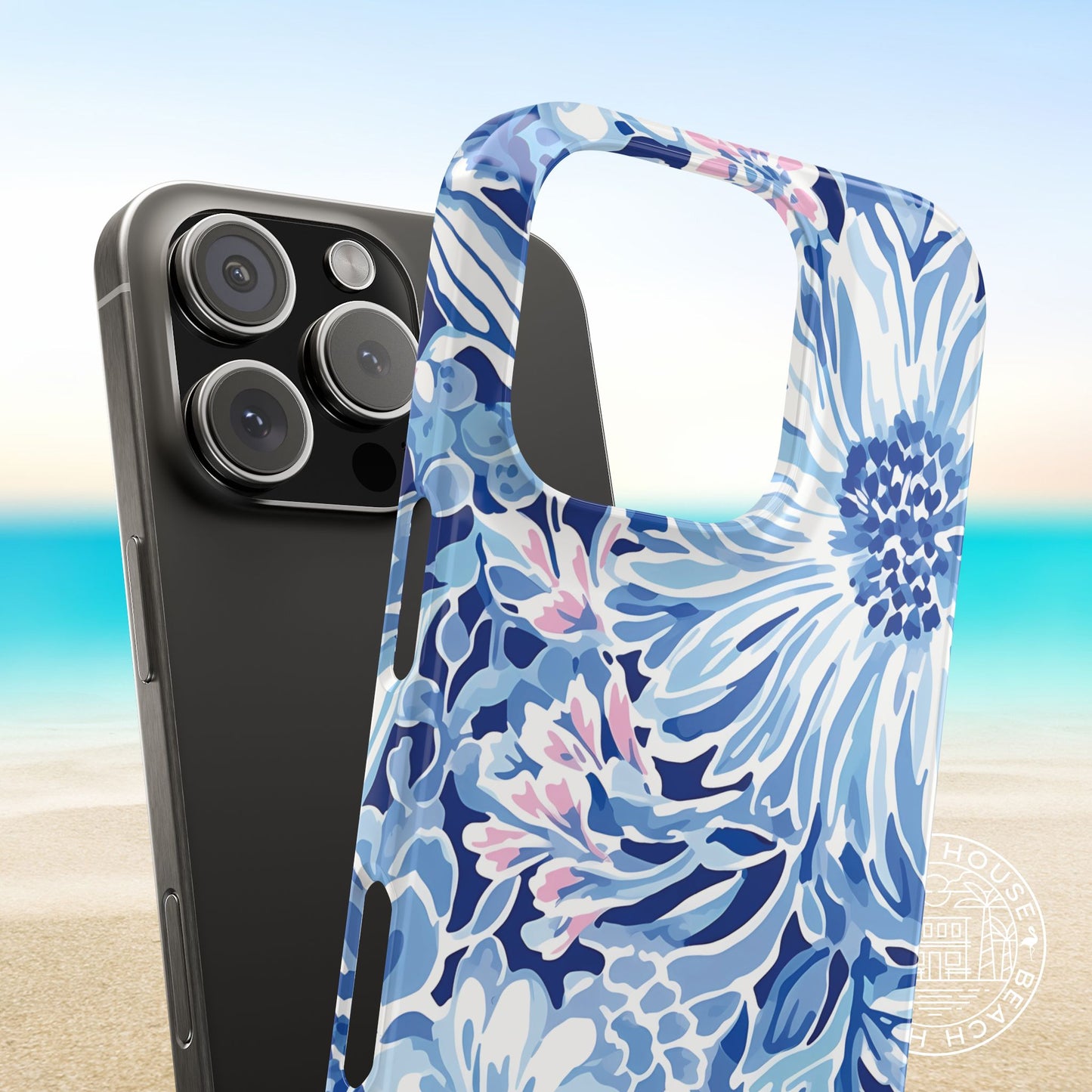 Snap on style Huntington Slim Case for iPhone next to a phone, with a beach background
