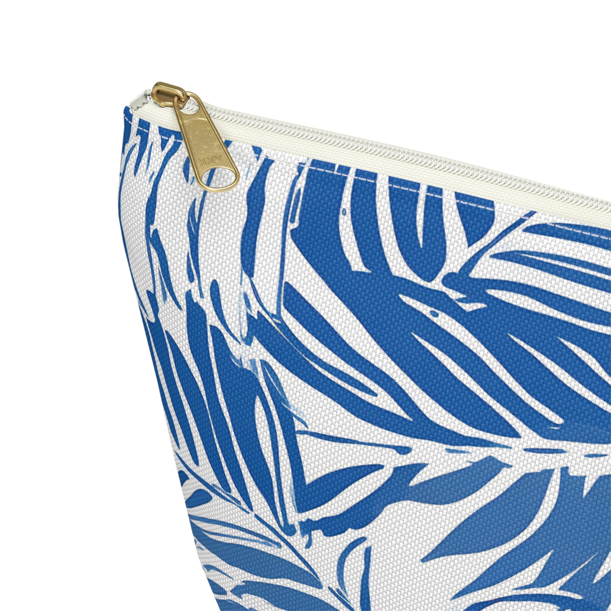 Pouch with blue leaf pattern and gold zipper on a white background
