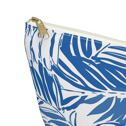 Pouch with blue leaf pattern and gold zipper on a white background