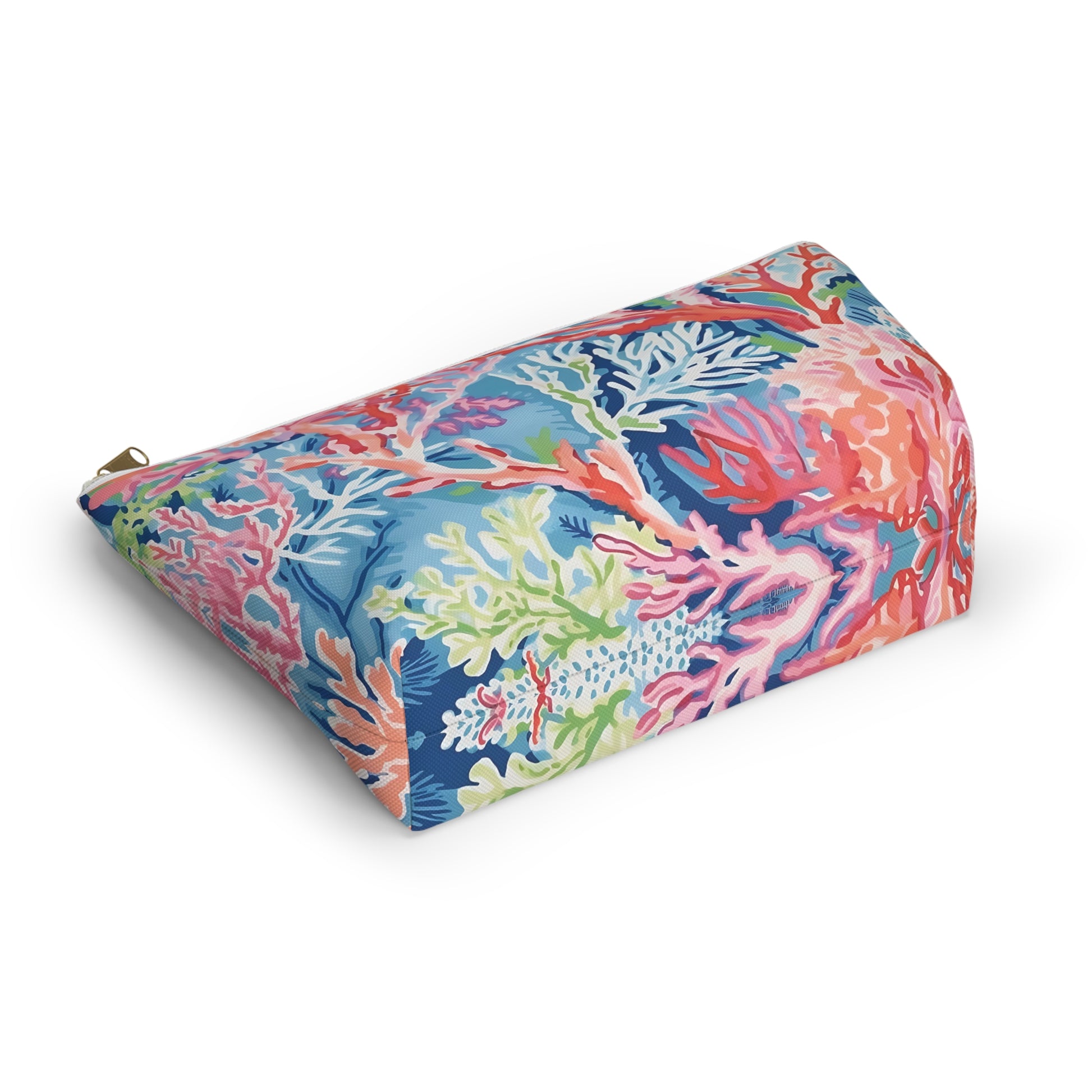 Colorful rectangular pillow with coral and sea-themed pattern on a white background