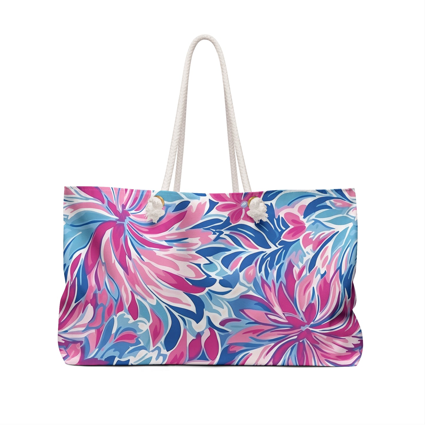 Floral patterned Destin weekender tote bag with a white handle on a white background
