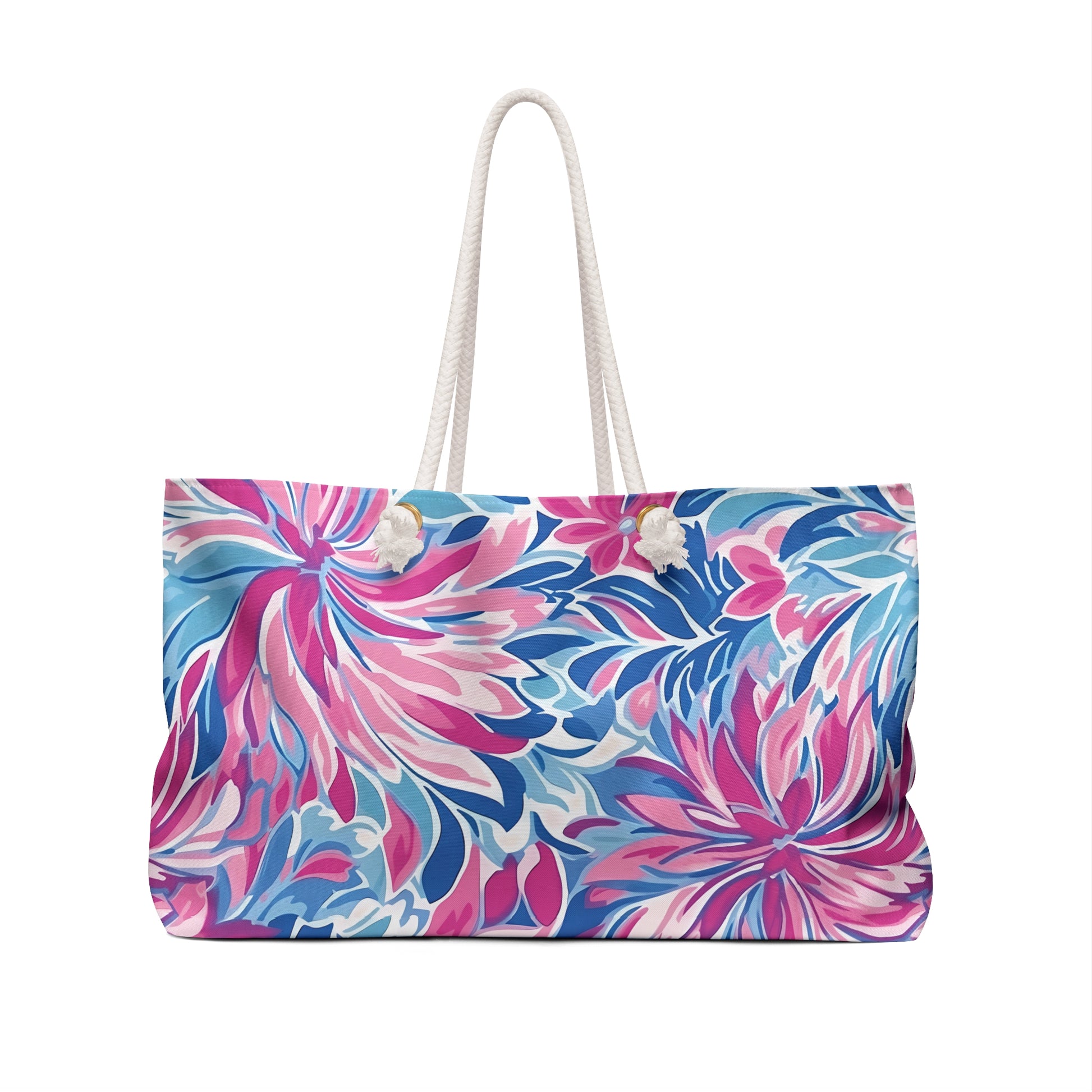 Floral patterned Destin weekender tote bag with a white handle on a white background