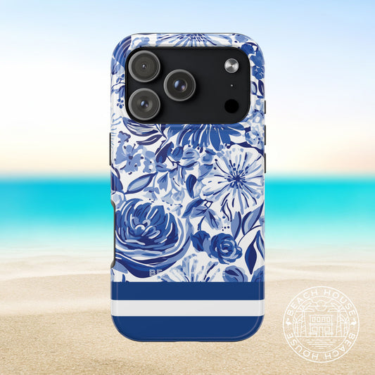 Lexington Tough Case for iPhone 17 Pro with blue floral design on a beach background