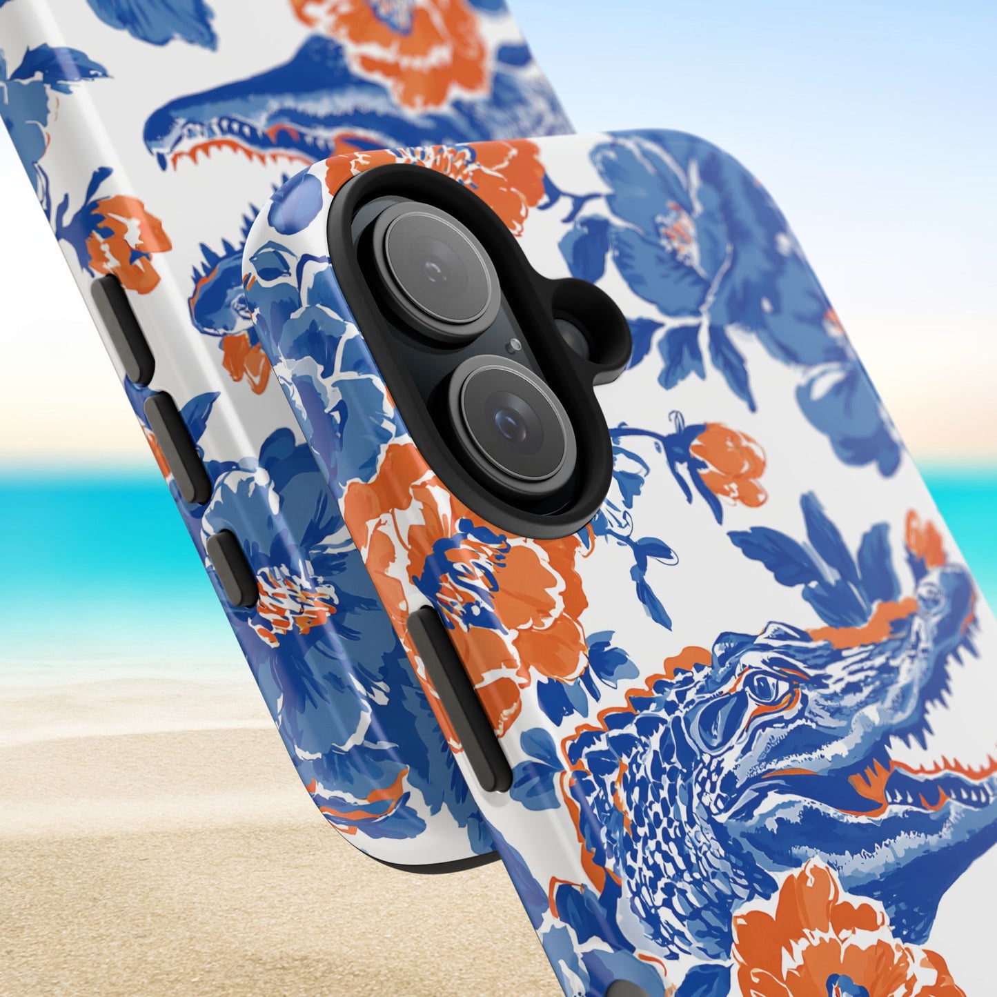 Gainesville Tough Case for iPhone with blue and orange alligator design on a beach background